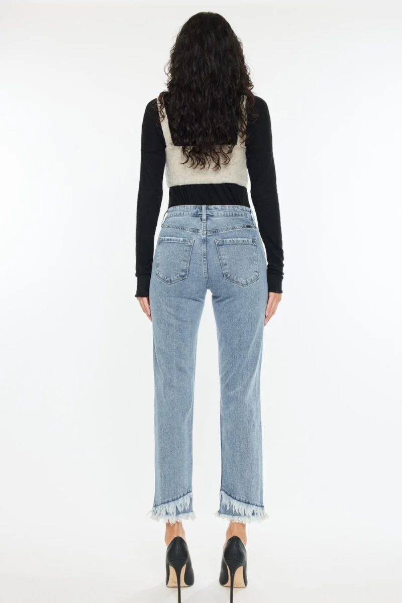 Close-up of raw hem on denim jeans