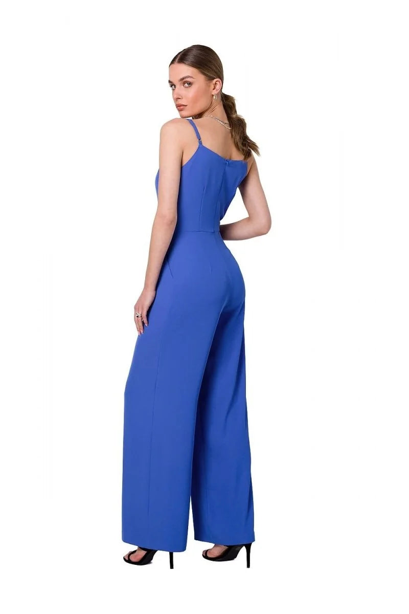 Royal blue wide-leg jumpsuit with spaghetti straps and a fitted bodice, shown on a model from the back.