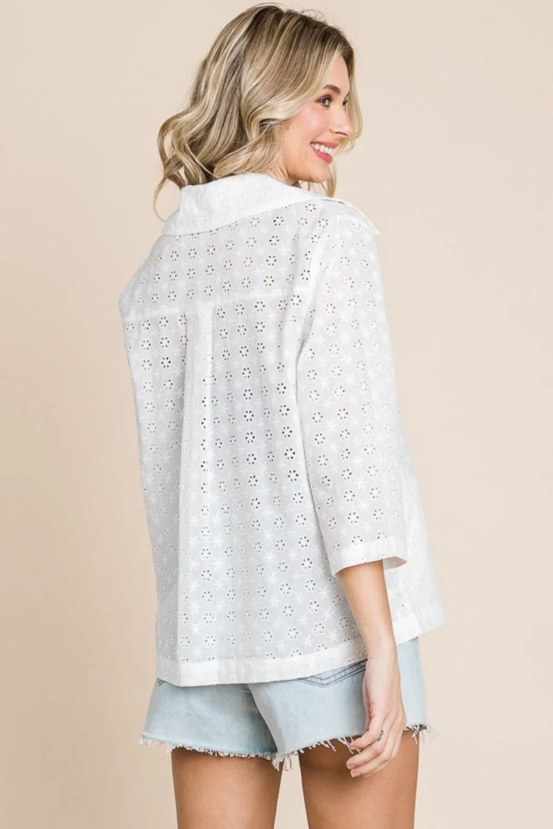 White eyelet cotton jacket with a tailored fit, showing the back with 3/4 sleeves.