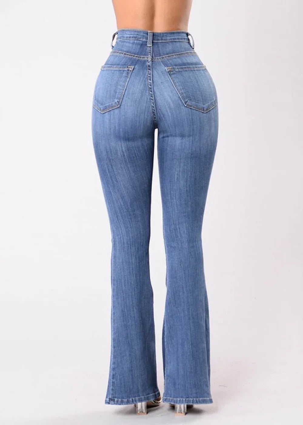Detail of button closure on wide-leg denim trousers