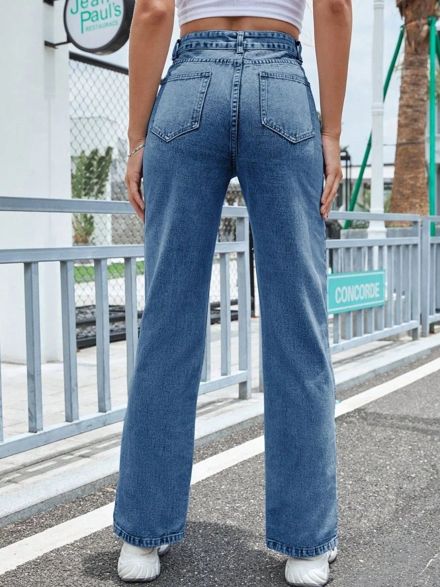 Close-up of pocket detail on slit jeans