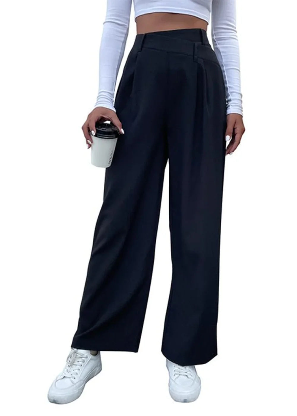 Black wide-leg trousers with a high waist, pleats, and white sneakers on model.