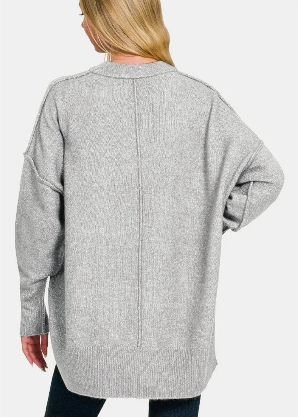 Back view of a light gray marled knit sweater with a crew neck and long sleeves.