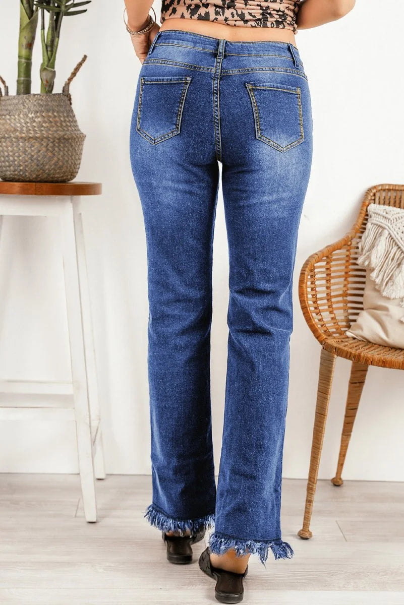 Model wearing light wash frayed hem jeans