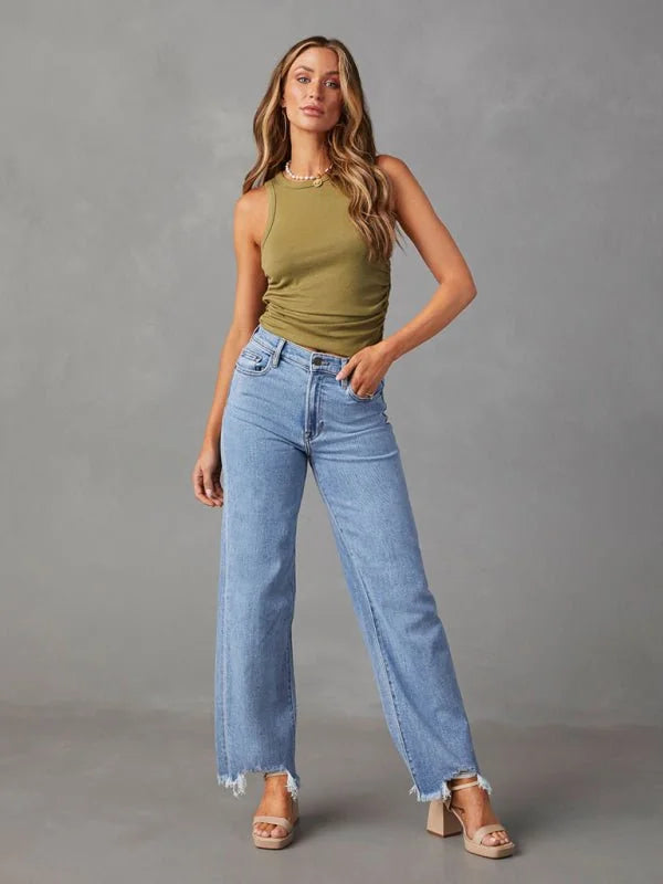 Light wash wide-leg jeans with frayed hems on a model.