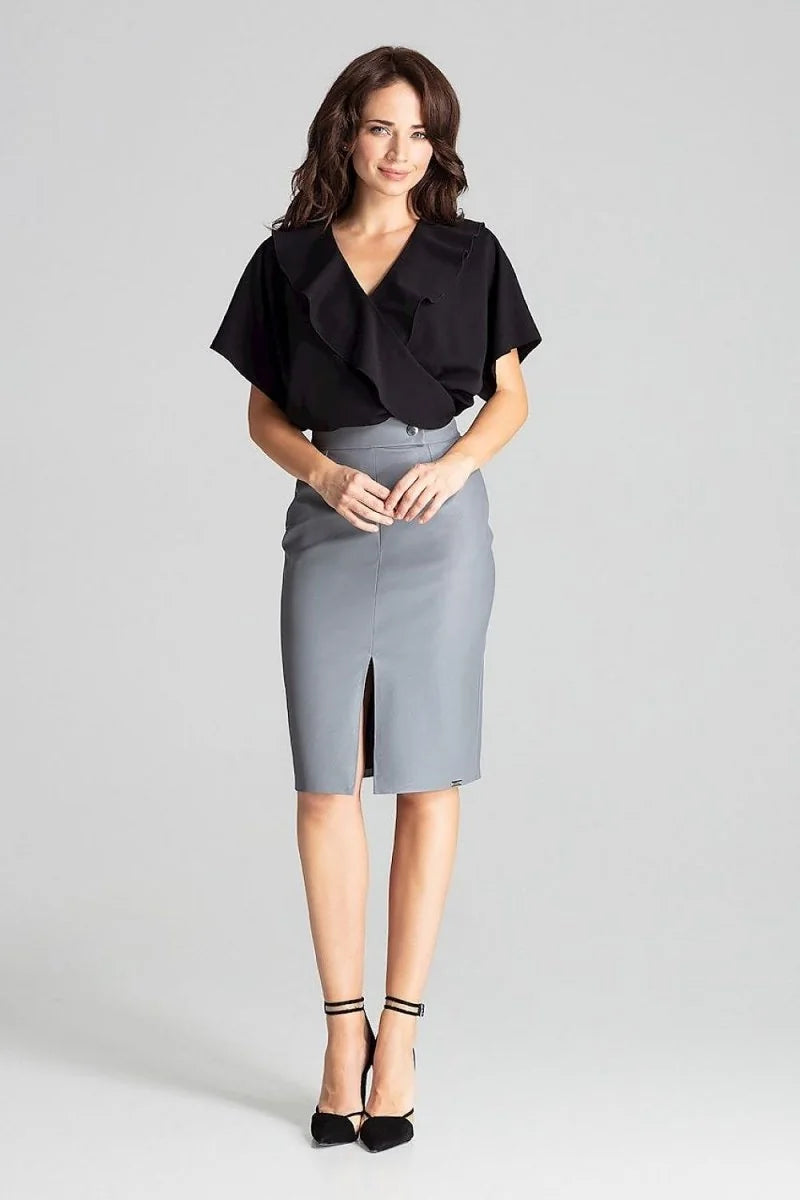 Detail of decorative clasp on black midi skirt