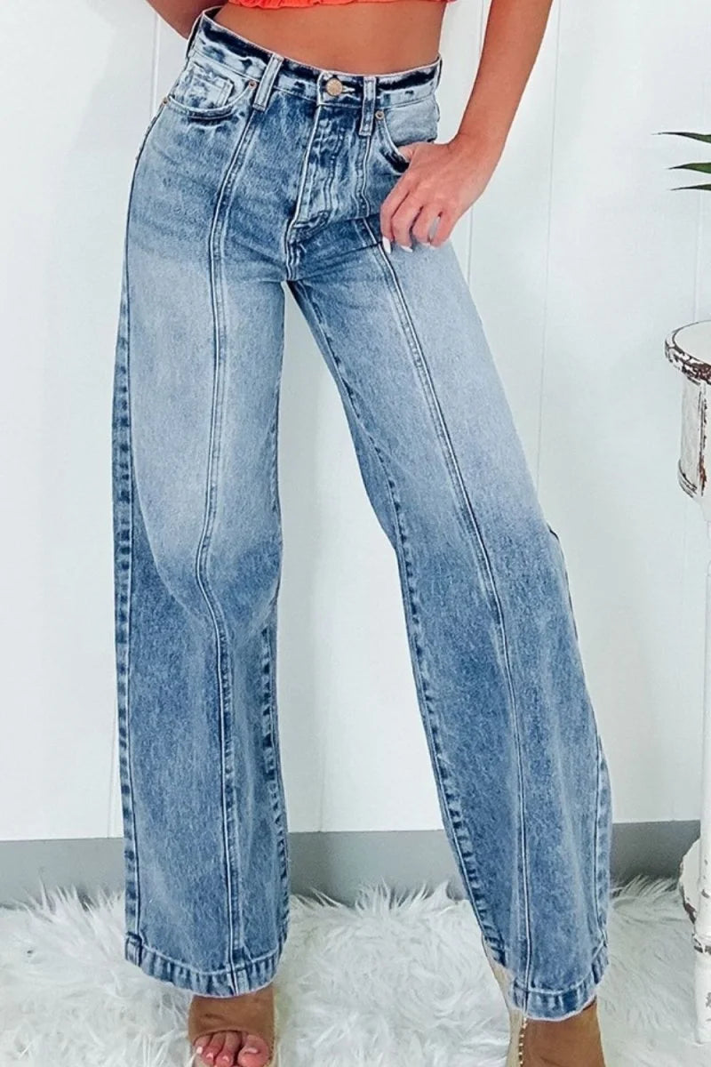 Light wash, slightly stretchy denim wide-leg jeans with front seams and a distressed look.
