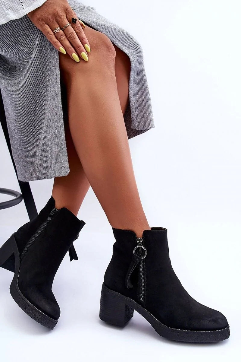 Close-up of the side zipper detail on women's boots