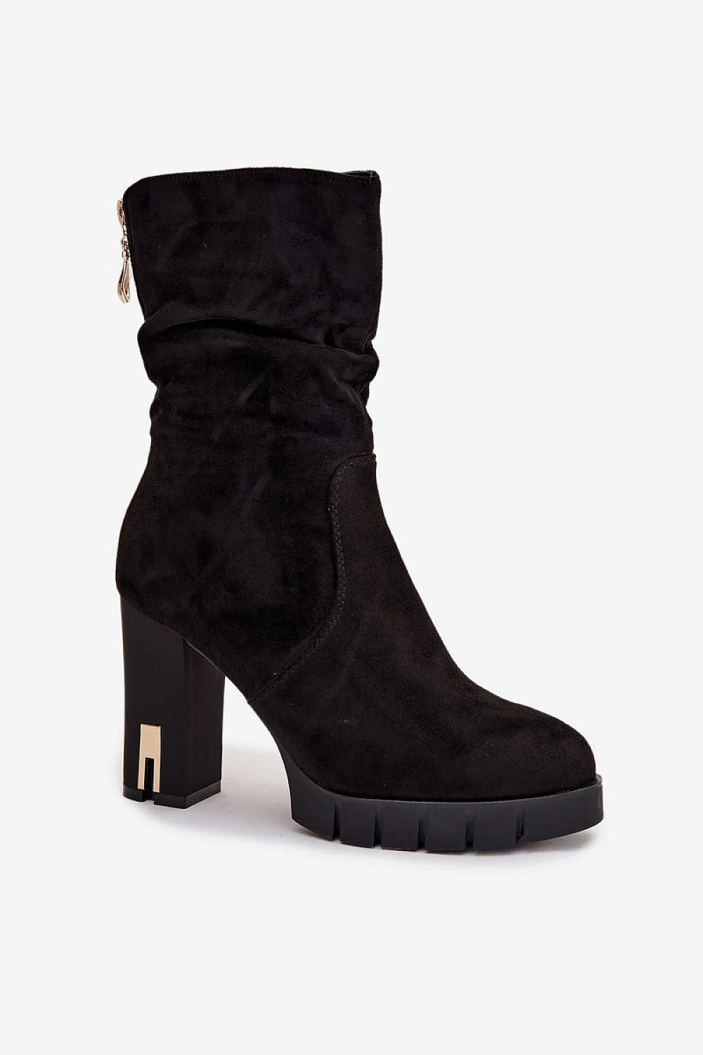 Black suede slouch boot with a chunky platform sole and a gold accent on the block heel.