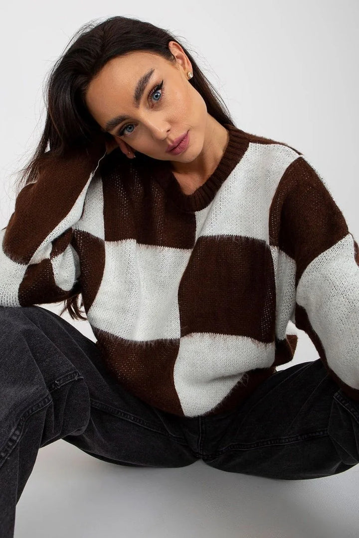 Brown and white checkered knit sweater with fluffy texture and a regular fit on a woman.