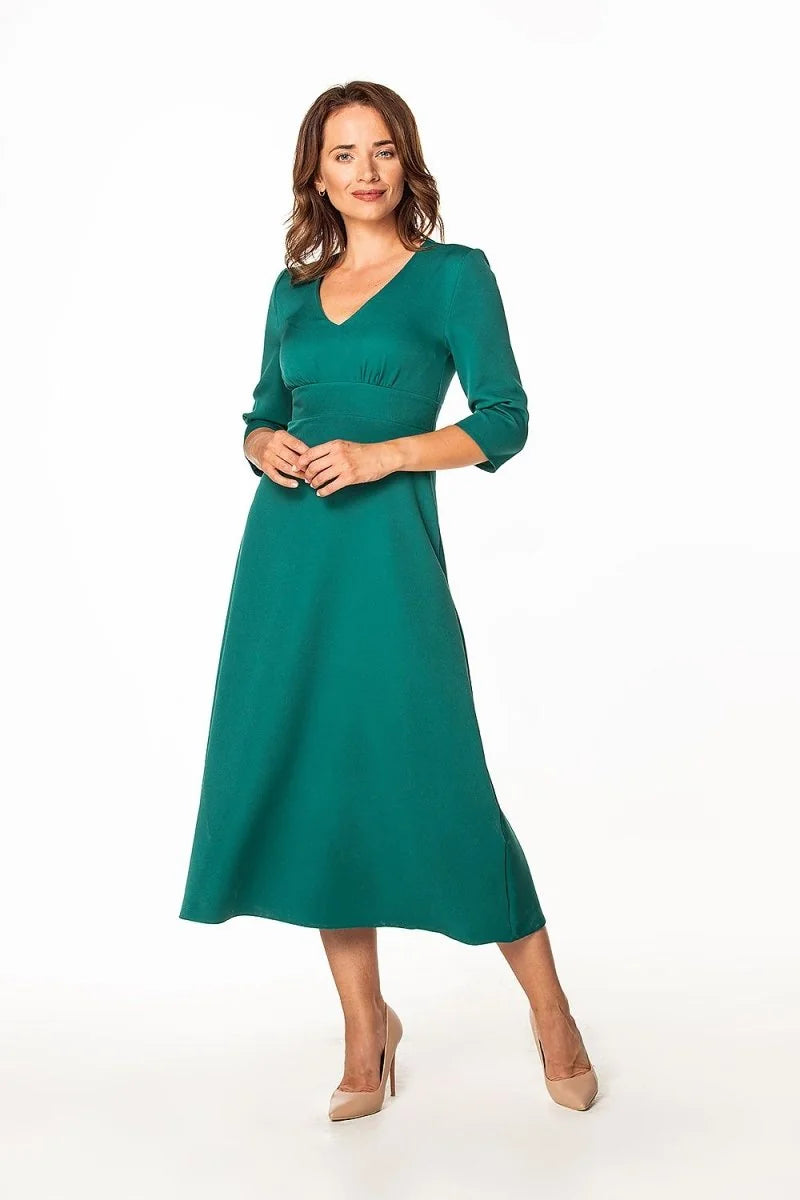 Emerald green midi dress with a V-neck and three-quarter sleeves, shown on a model.