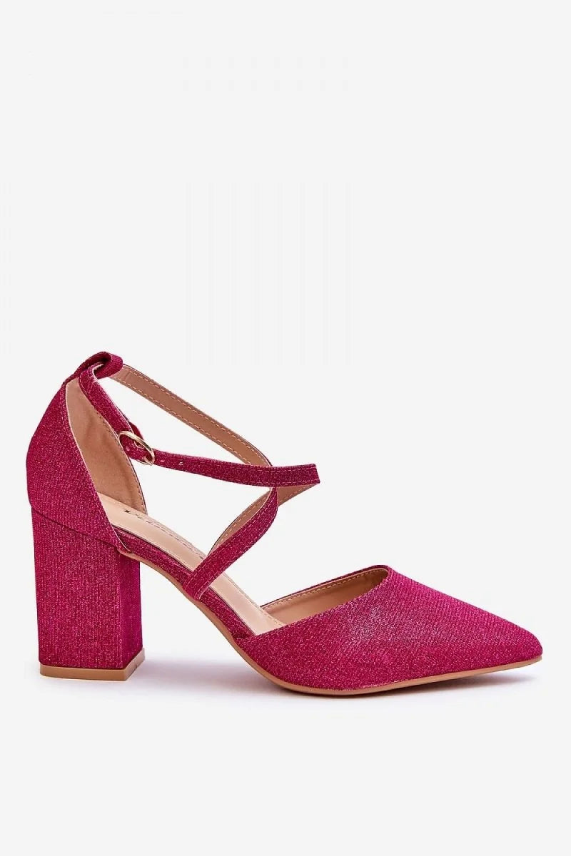 Close-up of pink glitter block heel pumps