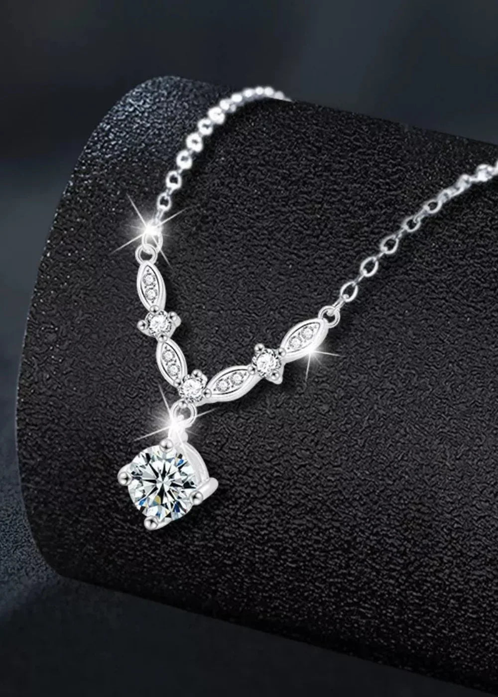 Close-up of the moissanite pendant on the silver chain