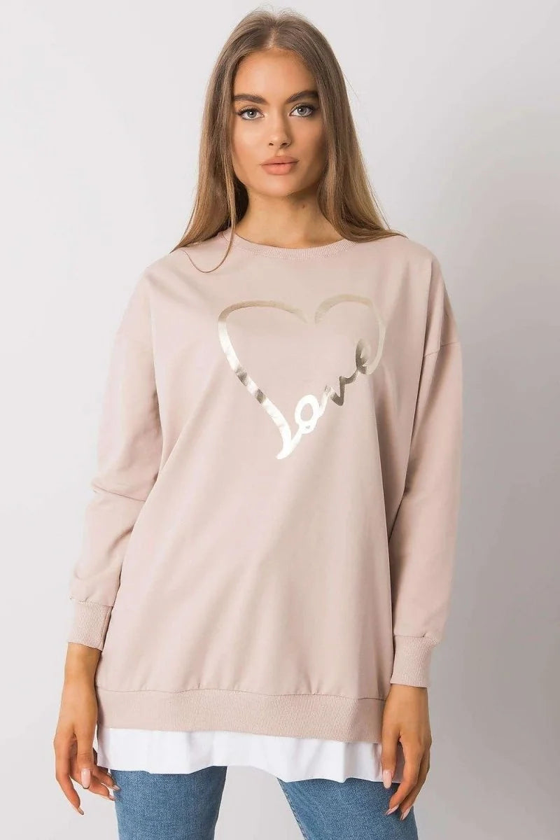 Close-up of print on beige tunic