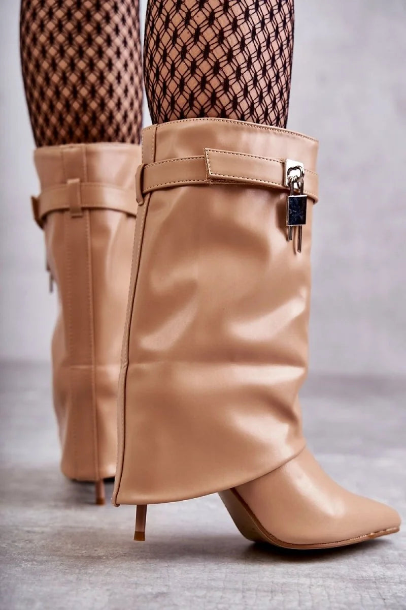 Close-up of beige eco-leather stiletto boots