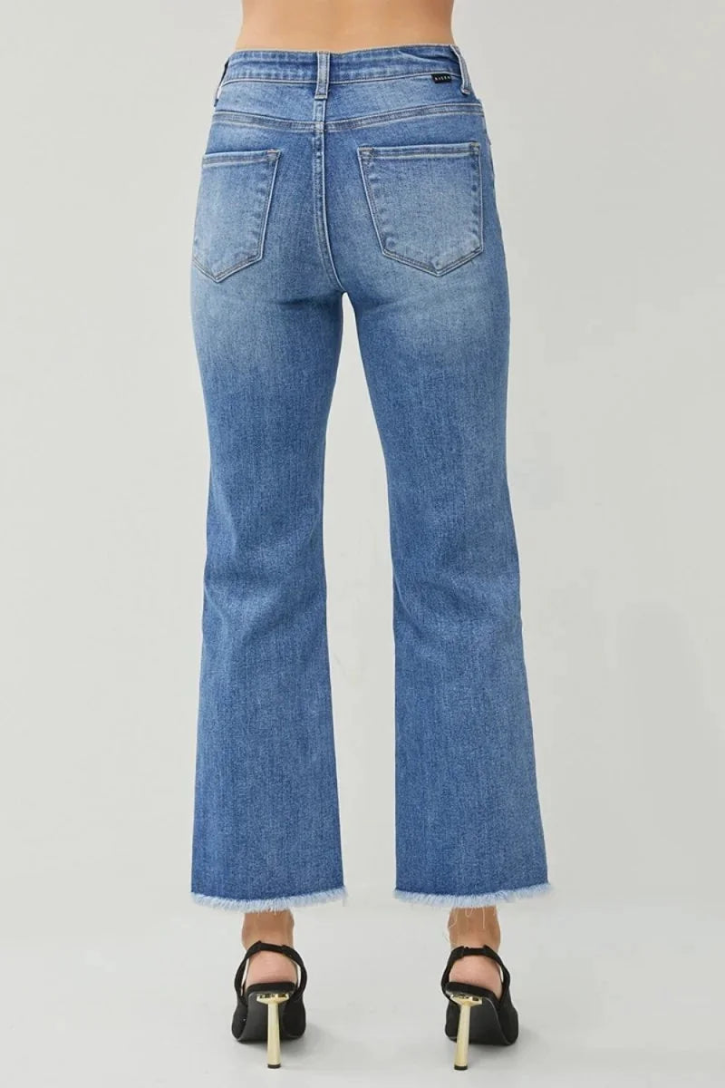 Detail of slit and raw hem on jeans