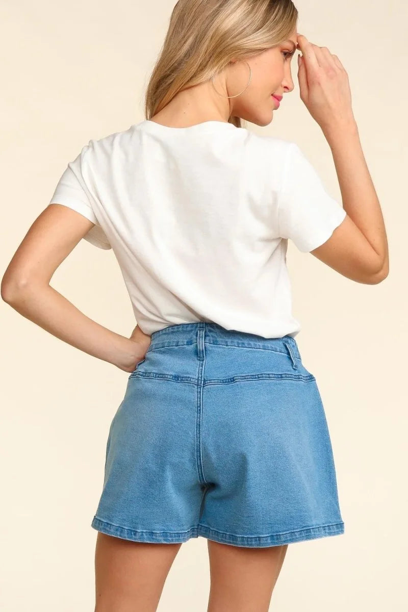 Light blue denim shorts with a regular fit, showing the back on a model.