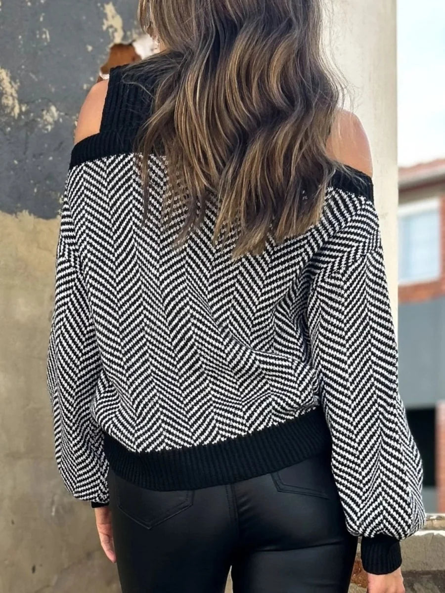 Detail of cold shoulder on black sweater