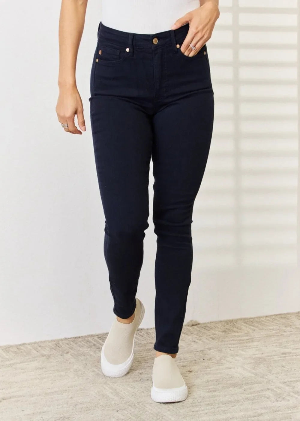 Close-up of the fabric texture on navy skinny jeans