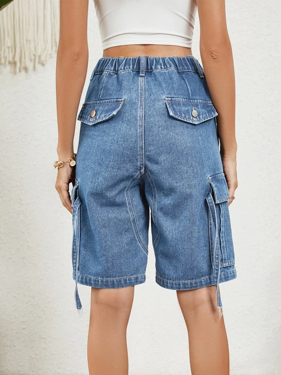 Close-up of pocket detail on denim shorts