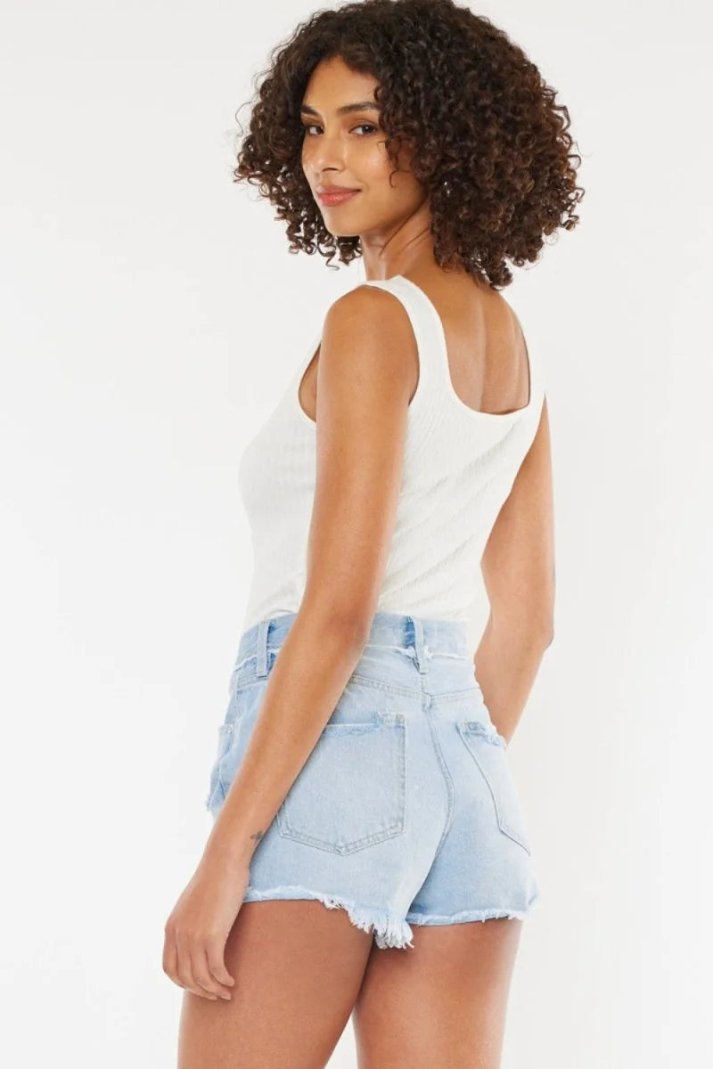 Light wash denim shorts with frayed hem and a distressed look.