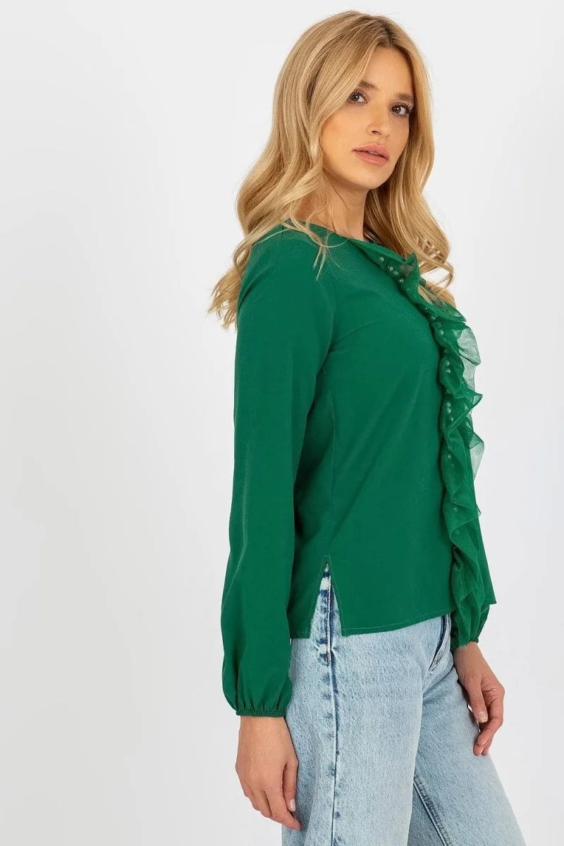 Green long-sleeve blouse with ruffled neckline and pearl details, worn by a model.