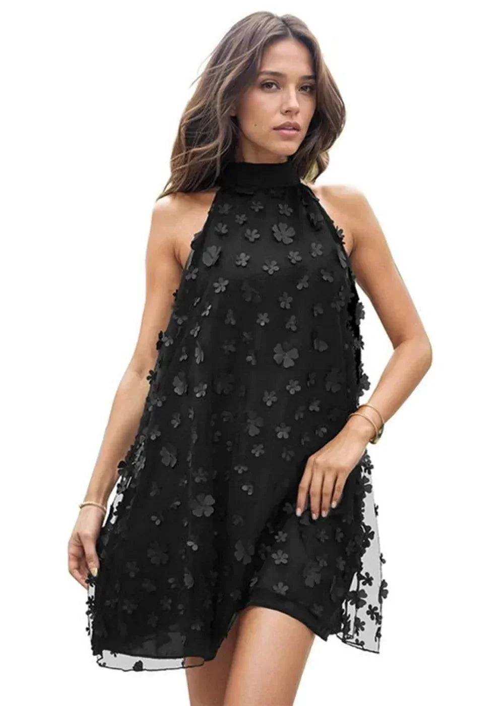 Black halter dress with 3D floral appliqué and a high neckline on a model.