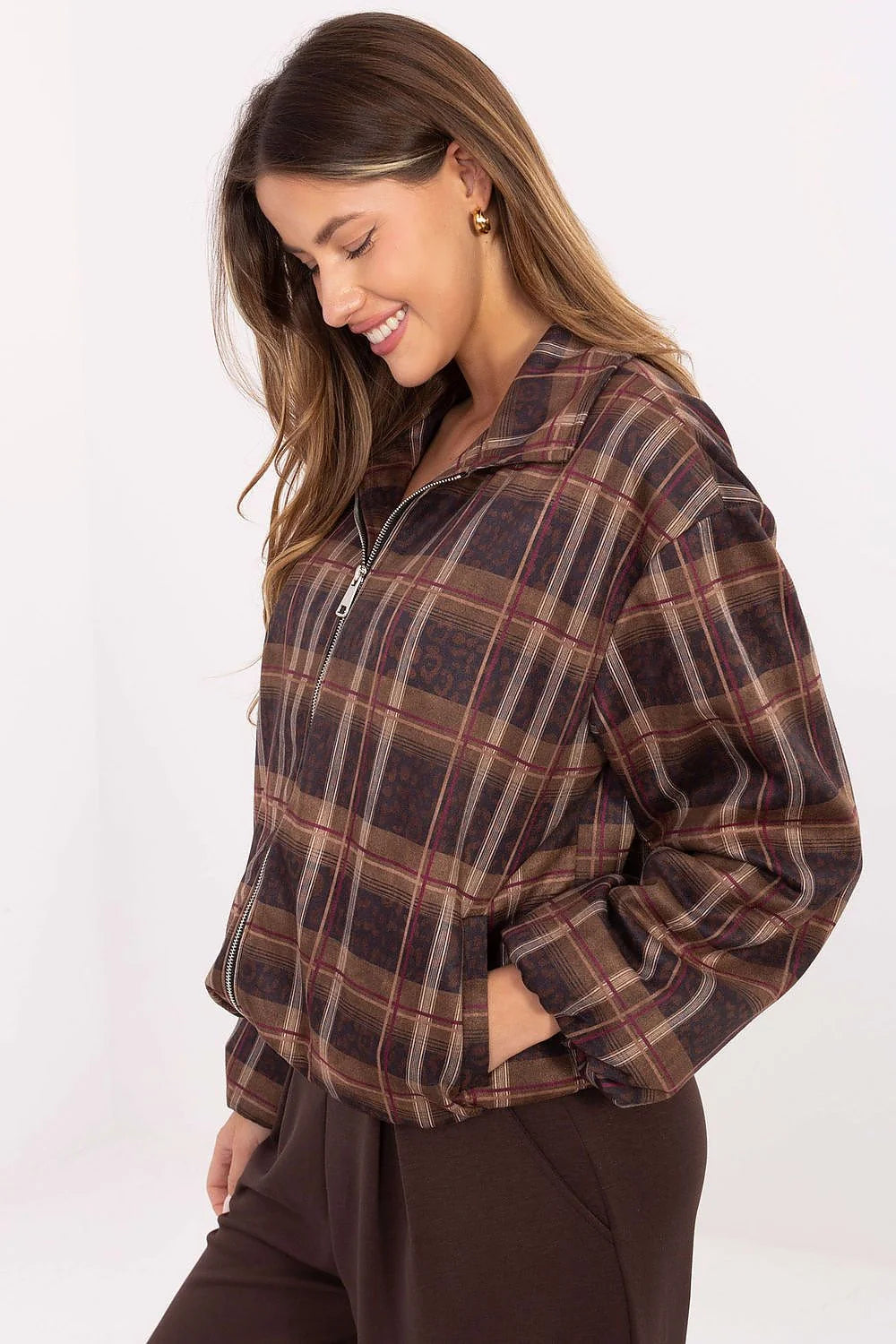Brown and maroon plaid jacket with zipper detail, on model