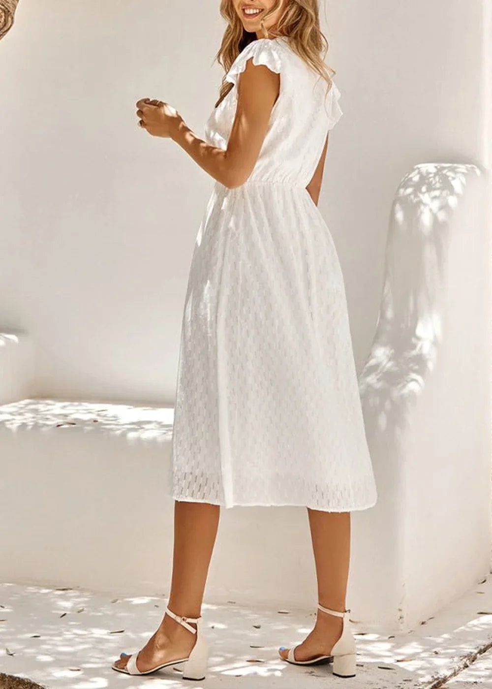 Close-up of V-neck on cotton dress