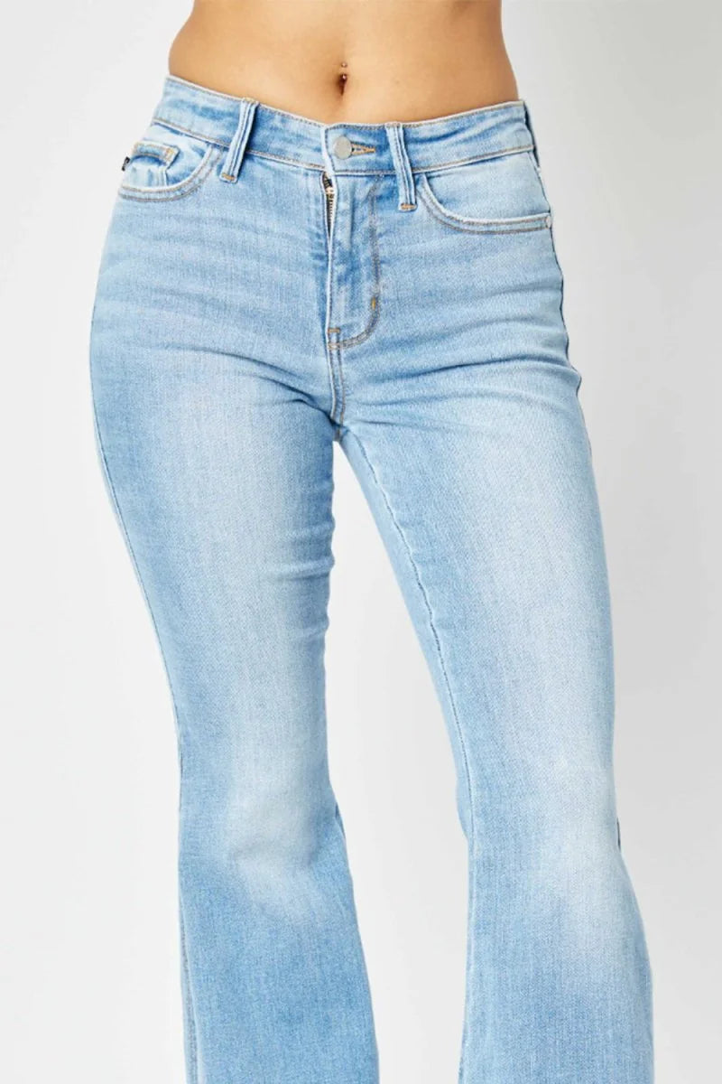 Close-up of slit detail on flare jeans