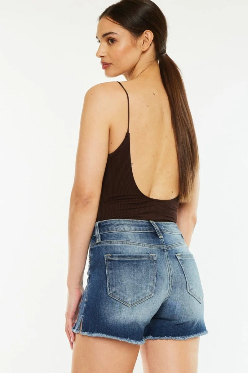 Detail of raw hem on denim shorts
