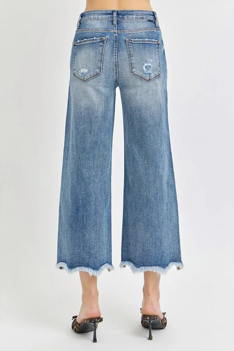 Detail of raw hem on cropped flare jeans