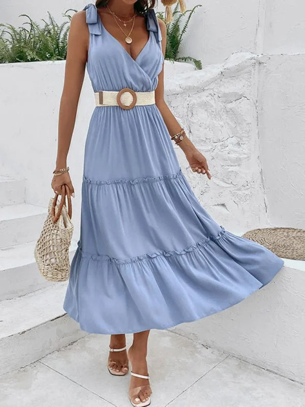 Light blue rayon maxi dress with tiered skirt, tie straps, and woven belt on model.