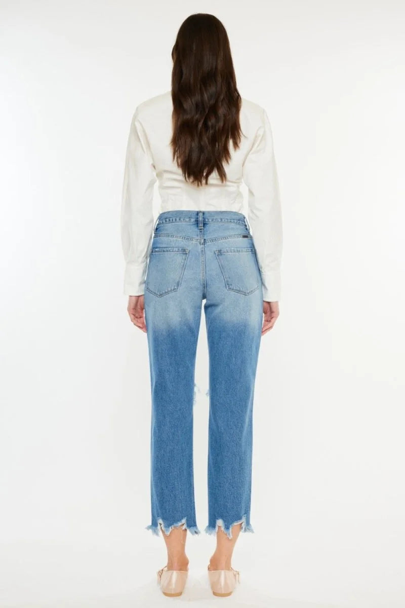 Close-up of frayed hem on jeans