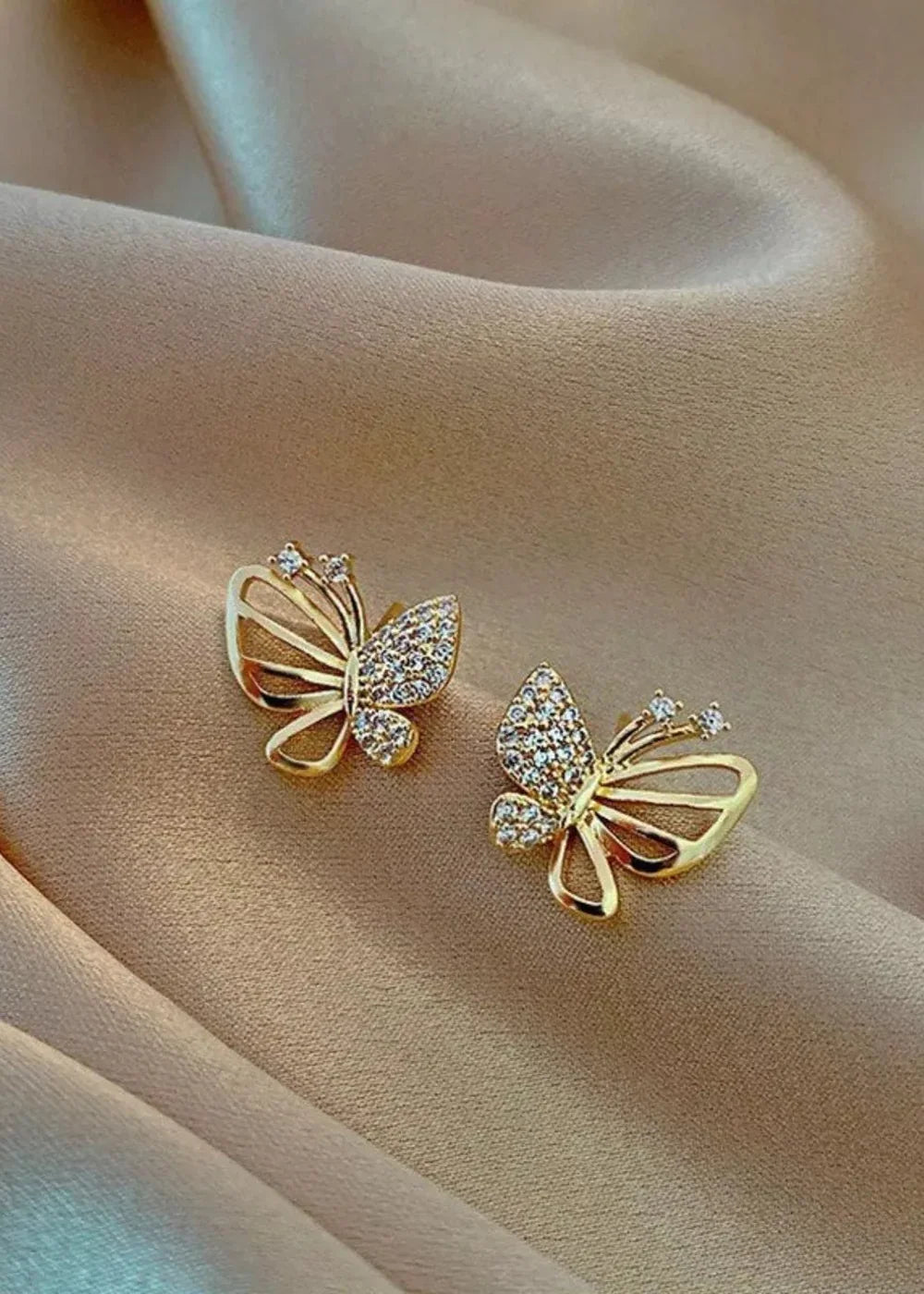 Close-up of butterfly design on earrings