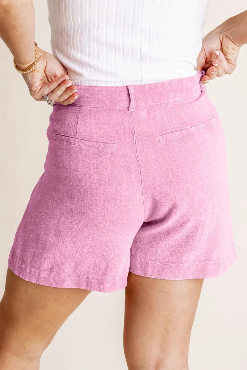 Close-up of pleat detail on linen shorts