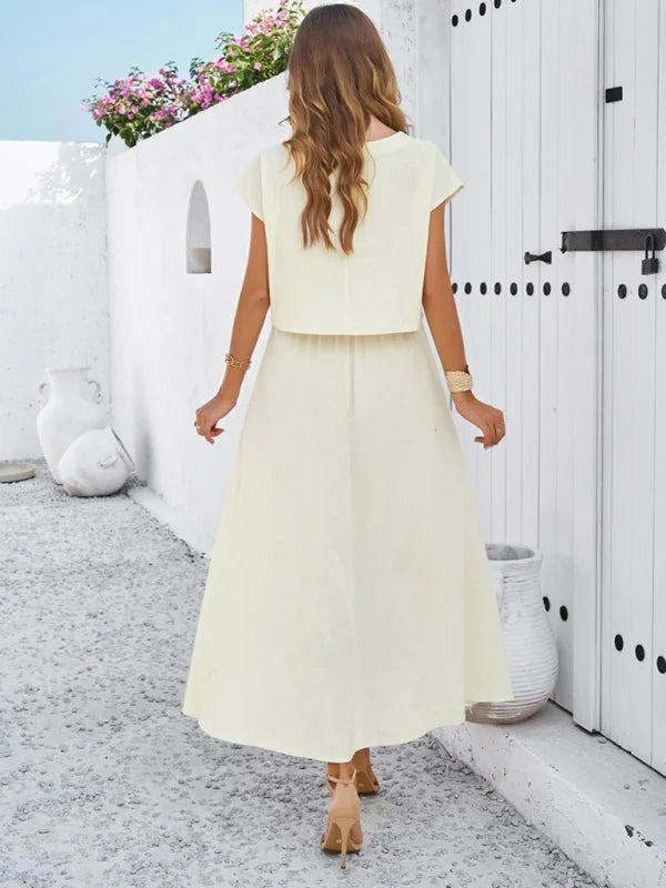 Black sleeveless top and long skirt suit