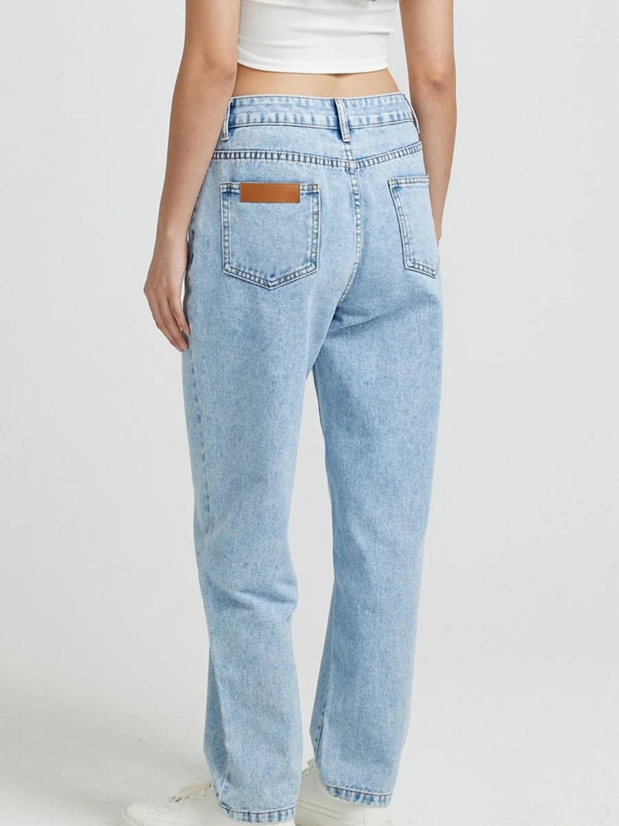 Medium wash pocketed straight leg jeans