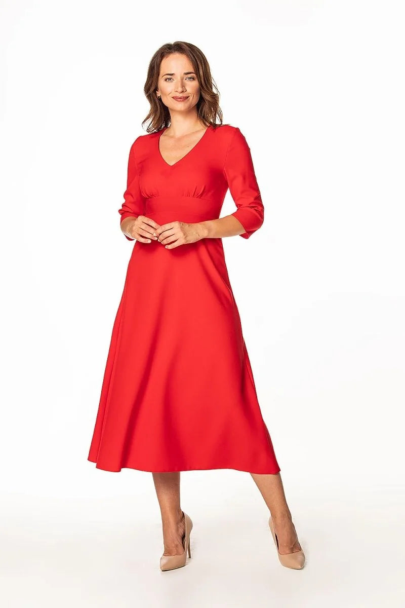Red V-neck midi dress with three-quarter sleeves and a flared skirt, worn by a woman with nude heels.