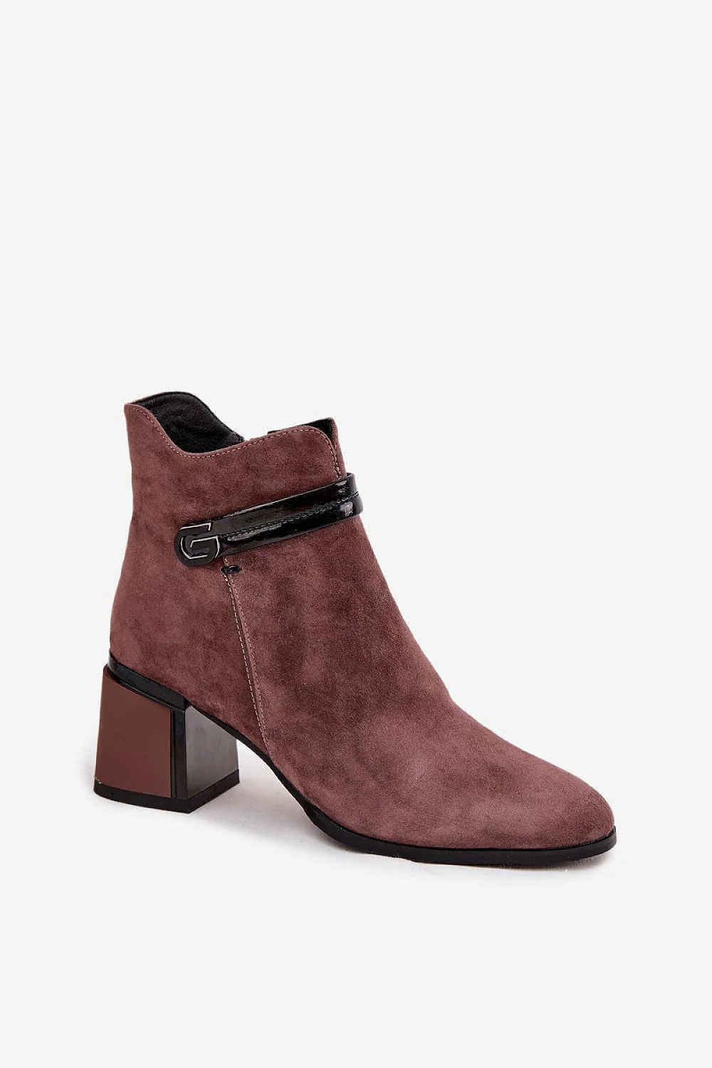 Close-up of brown suede ankle boots heel