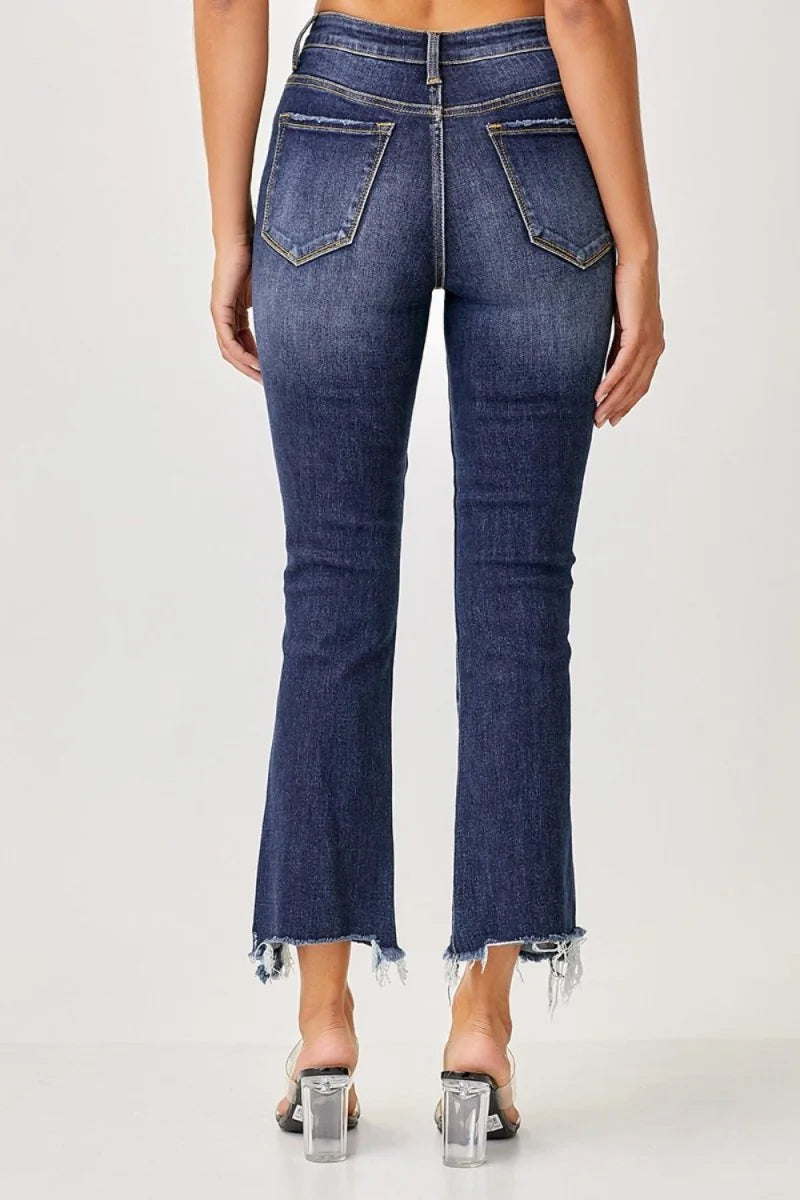 Close-up of the frayed hem detail on jeans
