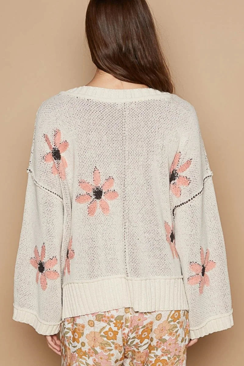 Cream chenille relaxed fit sweater with pink floral embroidery and wide sleeves.