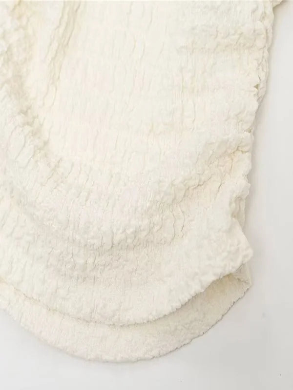 Close-up of the fabric and design of the pantsuit