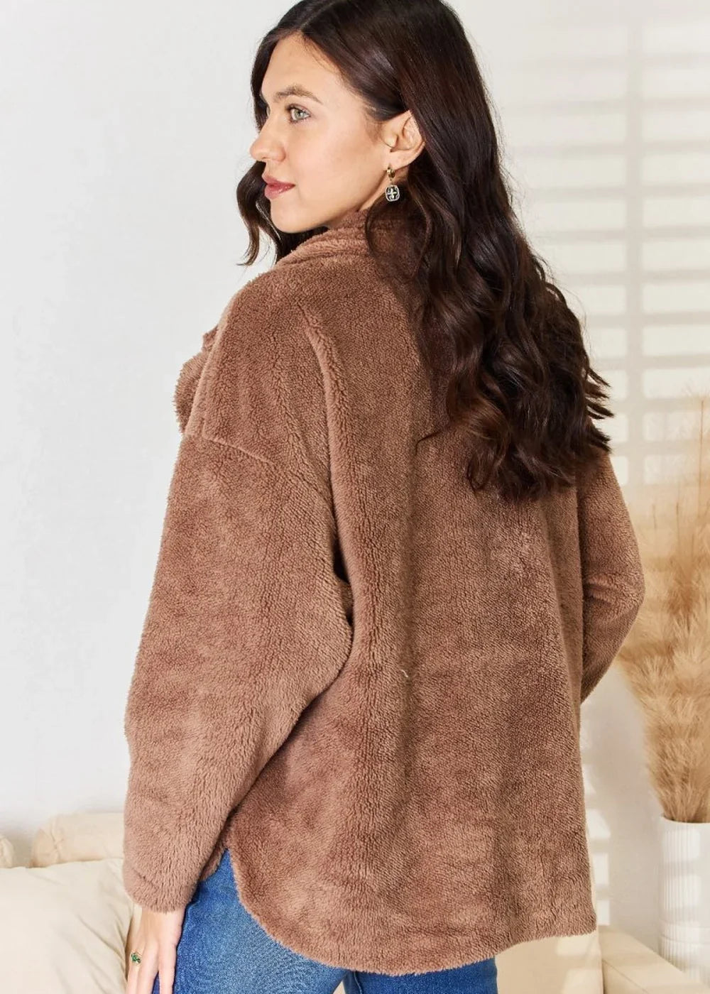 Brown plush jacket with a fuzzy texture, worn by a model from the back.