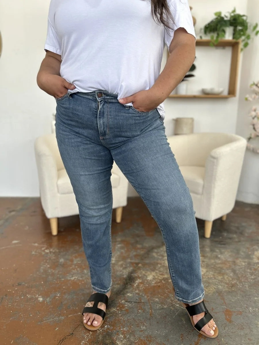 Model wearing high waist straight leg jeans