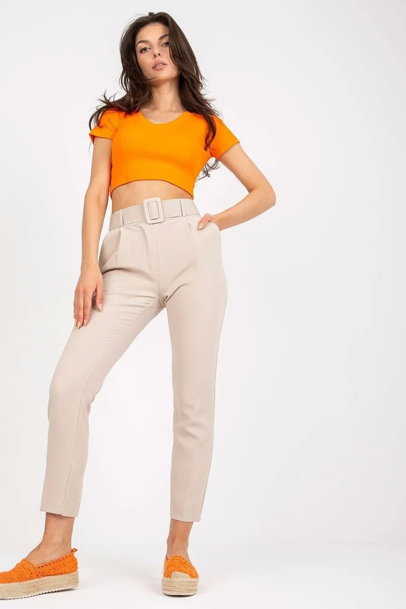 Beige high-waisted trousers with a belt and a regular fit, shown on a model.