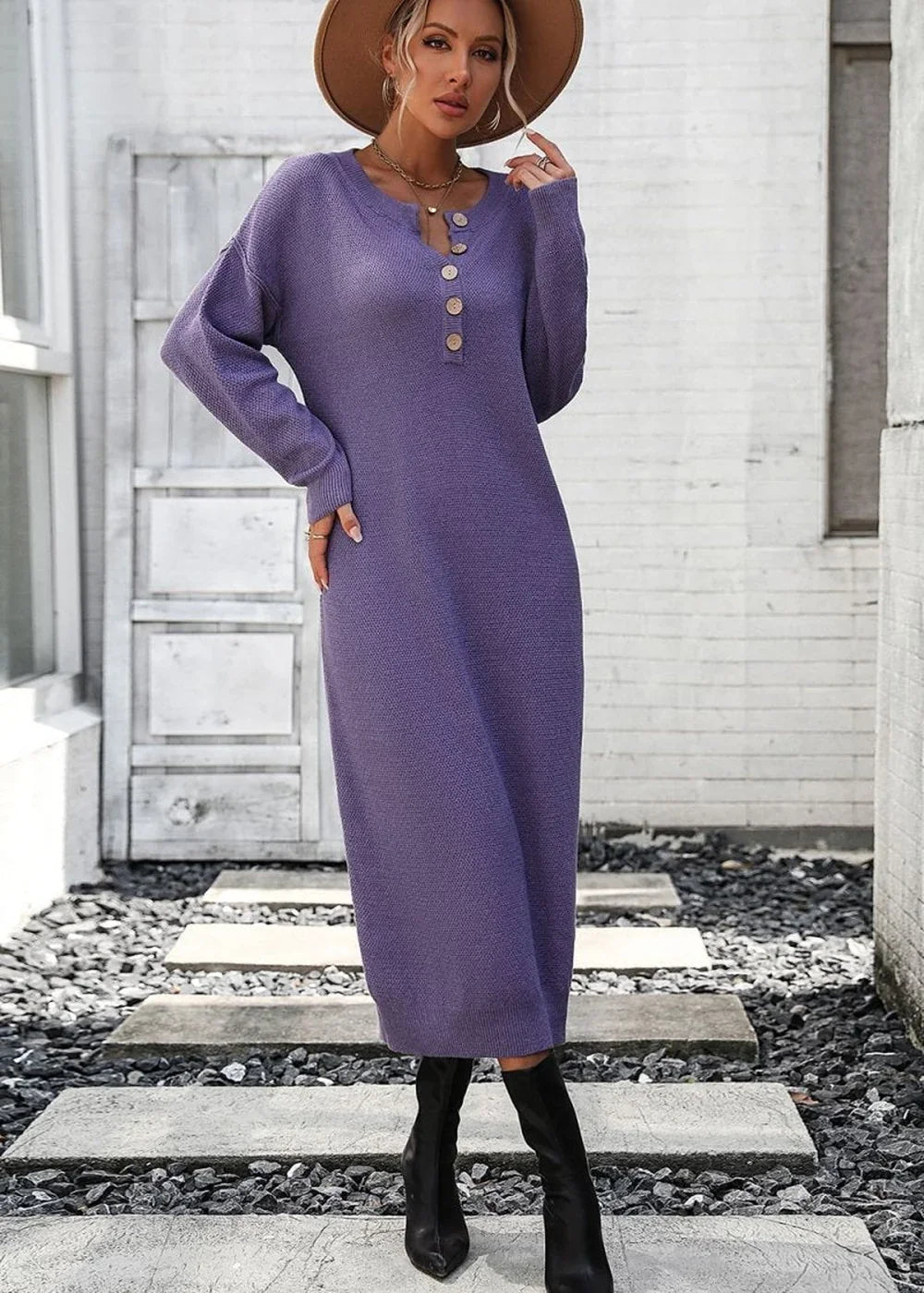 Purple knit midi dress with button detail and long sleeves, worn with black boots and a brown hat.