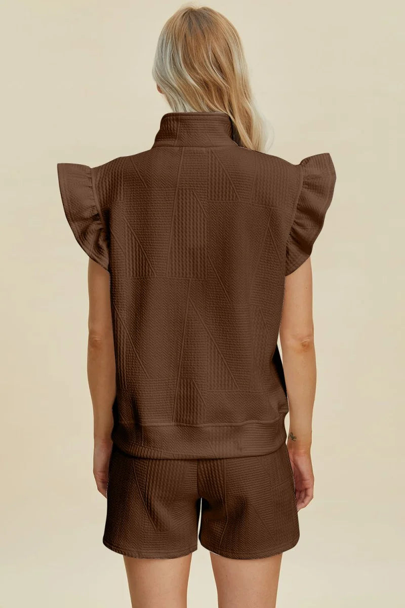 Brown textured short suit with ruffled cap sleeves and stand collar.