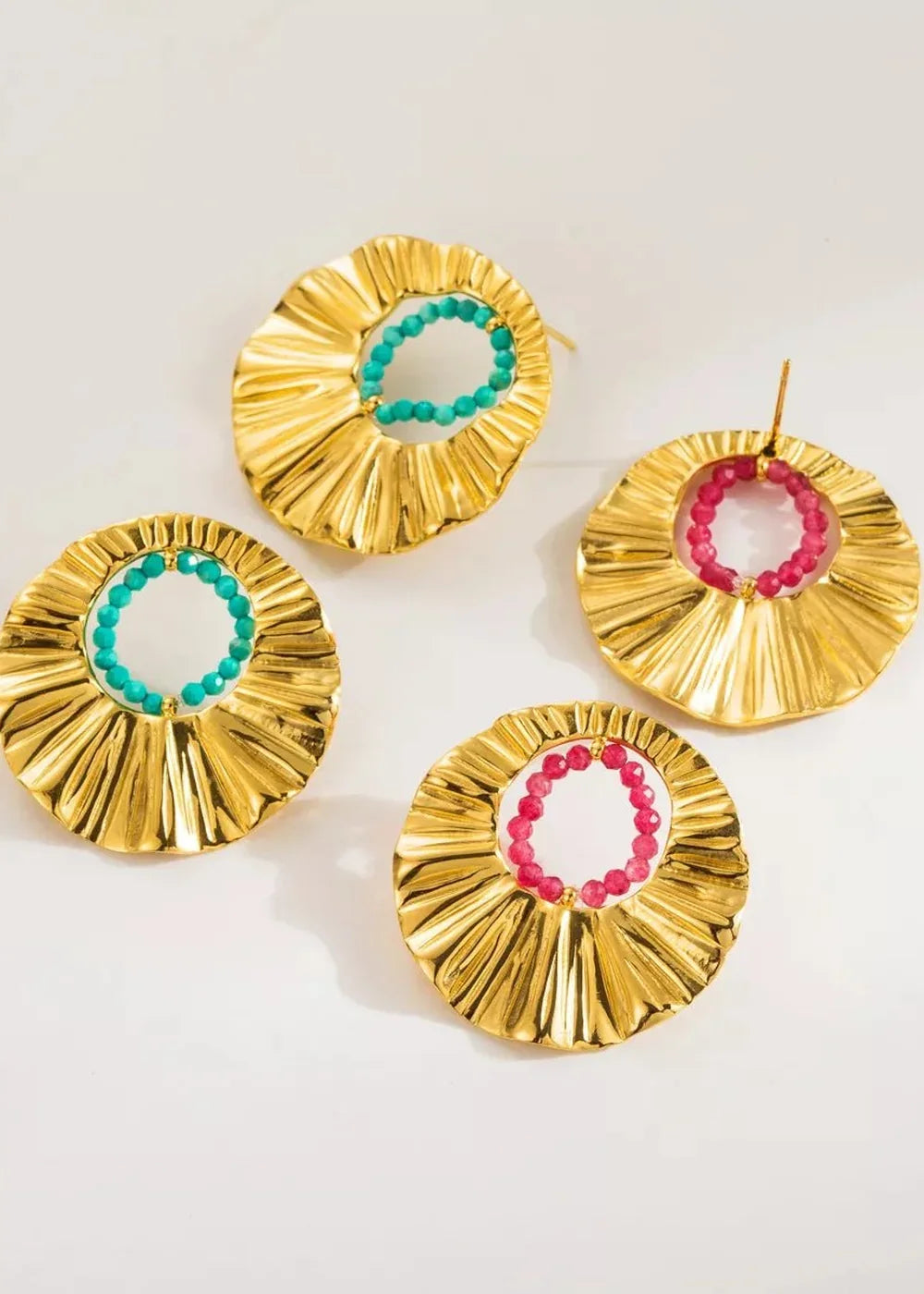 Close-up of rice beads on gold earrings