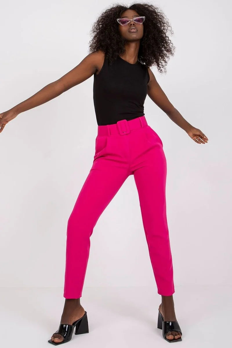 Bright pink high-waisted pants with a belt and a regular fit, shown on a model.